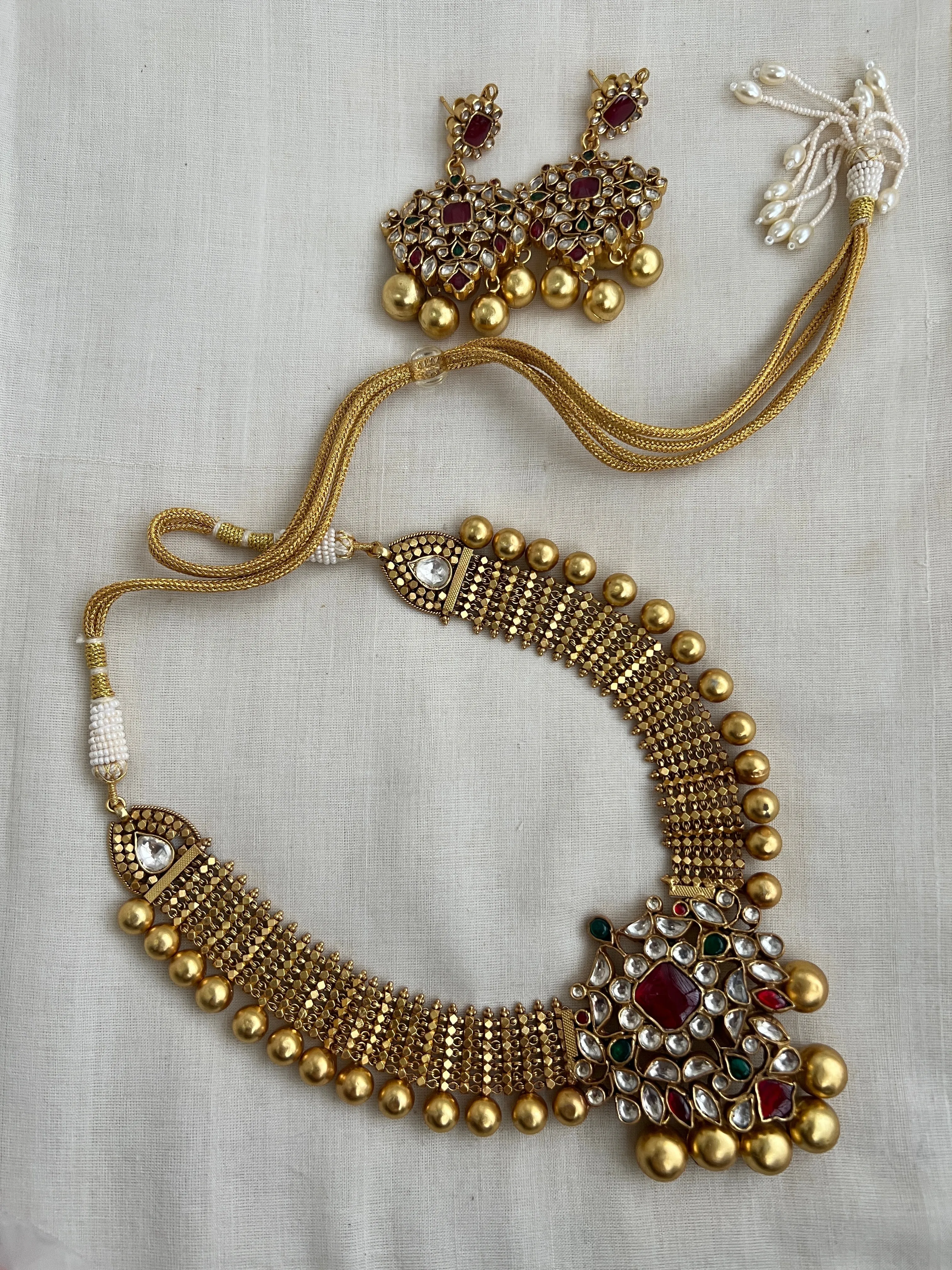 Antique gold polish set with kundan, ruby & emerald pendant with gold beads