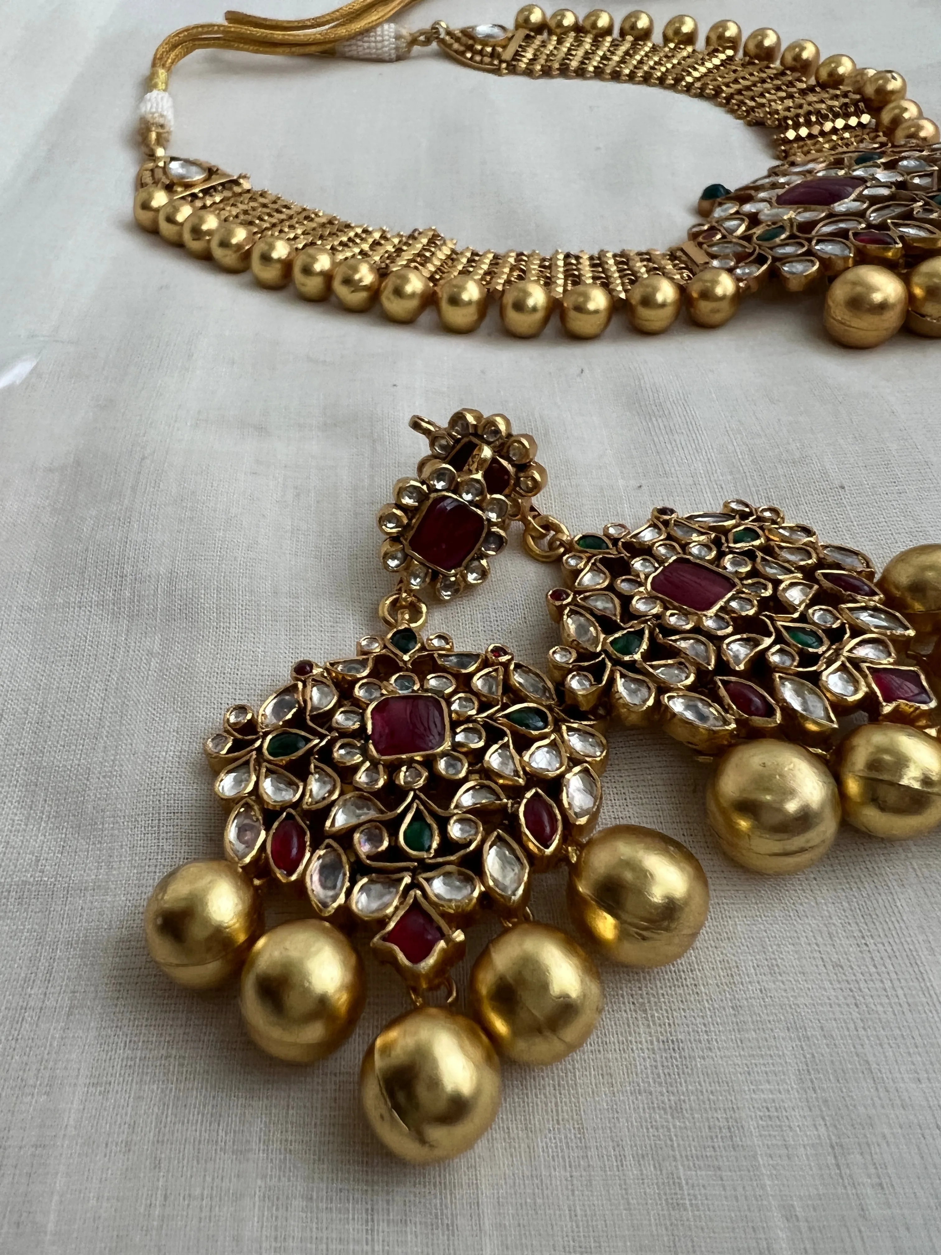 Antique gold polish set with kundan, ruby & emerald pendant with gold beads