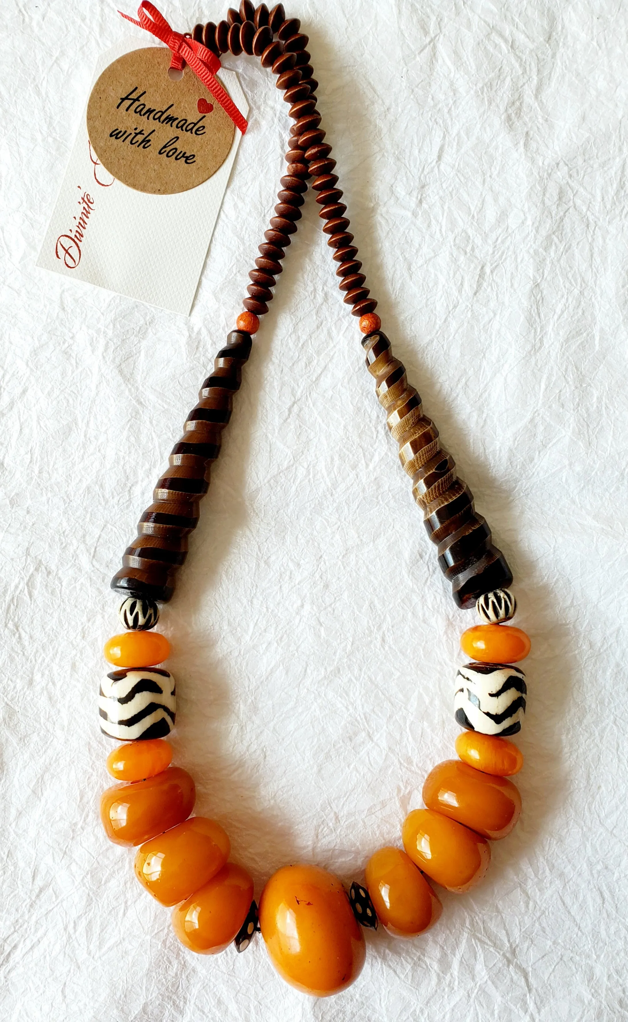 Carved Spiral Horn Bone Cone-shaped Orange Copal Amber Resin Polka Dot Batik Bone Bead Necklace, The Clove