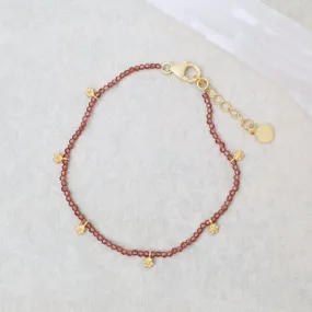 Faceted Garnets with Gold Charms Bracelet