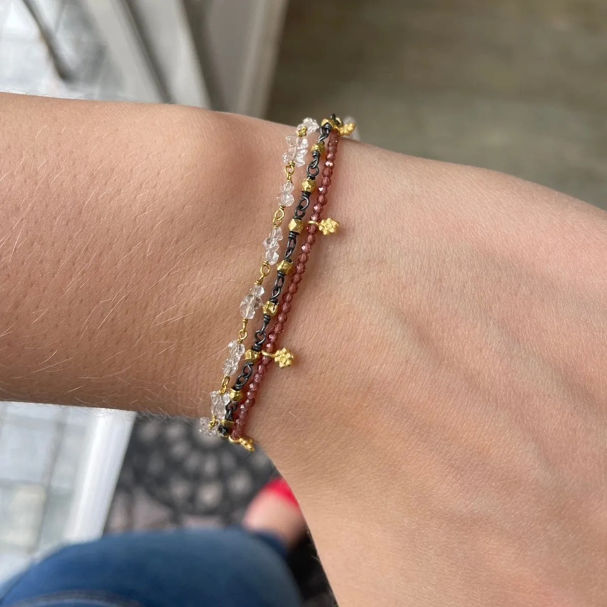 Faceted Garnets with Gold Charms Bracelet