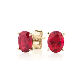 Oval stud earrings with ruby simulants in 10 carat yellow gold